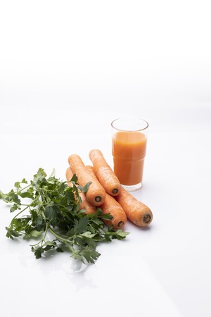 Vegetables and juice, fresh vegetable diet, composition on a white background.の写真素材