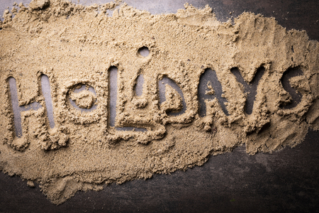 Background with the words Holiday. Sand, beach, horizontal compositionの写真素材