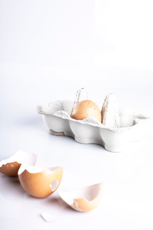 A composition of hen eggs on a dark background. Top view composition