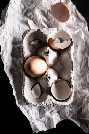 A composition of chicken eggs on a dark background. Top view compositionの写真素材