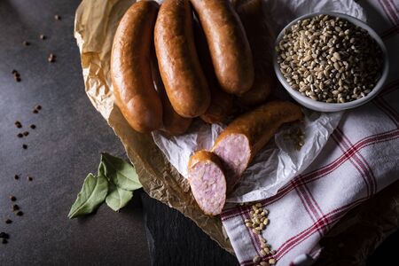 A thin pork sausage in composition with herbsの写真素材