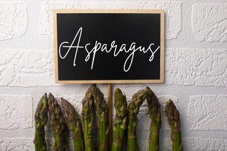Green asparagus, healthy seasonal vegetables on a white background.の写真素材