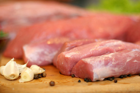 A composition of fresh, raw meat