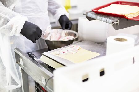 Hand-made dishes in a food factory.の写真素材