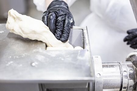 Production line, stages of dumpling production. Food factoryの写真素材