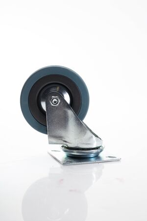 Side view of heavy duty metal caster wheel with mounting plate. Heavy duty swivel castor made of steel and PVC, isolated on a white background.の写真素材