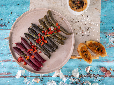 Grilled, roasted vegan, vegetarian sausages. Mediterranean style composition with toasts, spices and garlic.の写真素材
