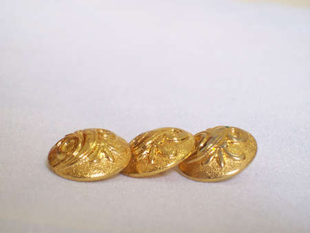 Gold buttonsの写真素材