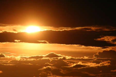 Sun behind the cloudsの写真素材