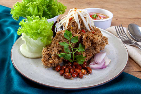 Crispy catfish salad with green mangoの写真素材