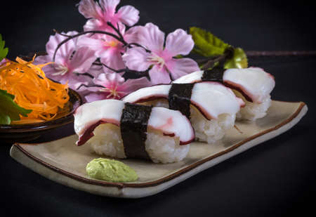 Close-up shot sushi isolated on black backgroundの写真素材