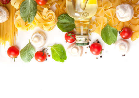 Pasta spaghetti with tomatoes, olive oil and spinach on a white backgroundの写真素材
