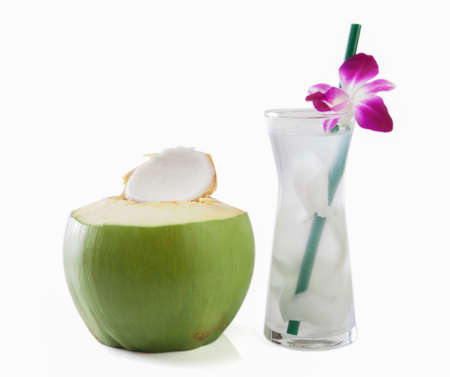 Green coconuts with drinking straw isolatedの写真素材