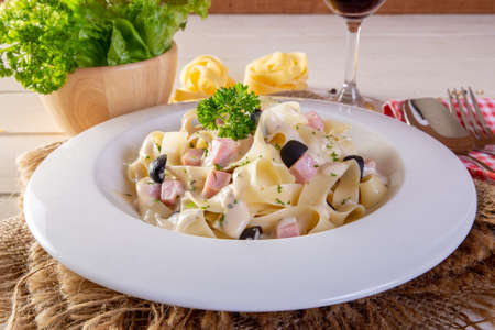 spaghetti with ham cream sauceの写真素材