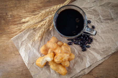 Deep fried dough or "patongko" coffee  in glass.の写真素材