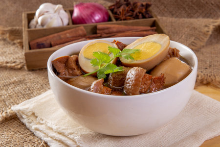 stewed eggs or eggs and pork in brown sauce by Thai foodの写真素材