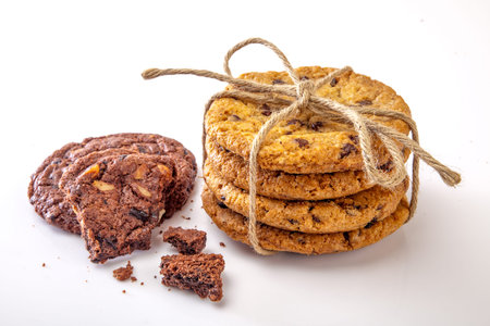 Dairy milk with home made cookies over white background