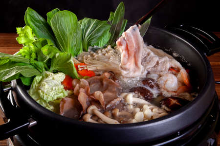 Pork slices Vegetable and egg for Sukiyakiの写真素材