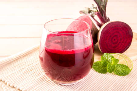 Beetroot cold pressed juice in glass, Healthy raw vegetable and fruit drink for detox.の写真素材
