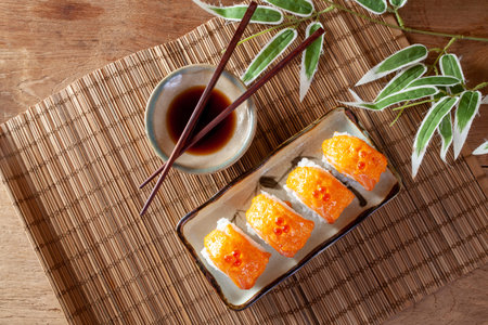 Empty plate on checkered tablecloth on white wooden tableの写真素材
