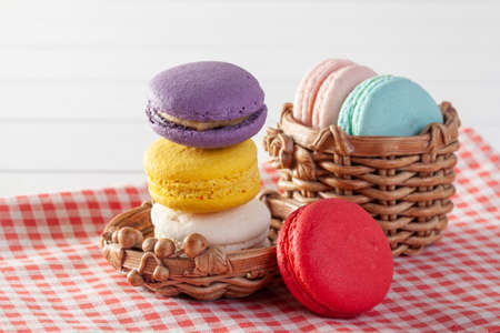 Colorful macaroons, delicious with cream and tea hotの写真素材