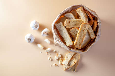 Garlic bread on orange backgroundの写真素材