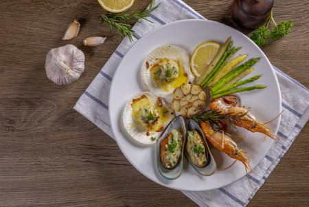 BBQ seafood and vegetables on the chopping boardの写真素材