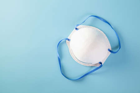 Mask with rubber ear straps. N95 mask to cover the mouth and nose. Procedure mask from bacteria. Protection concept.の写真素材