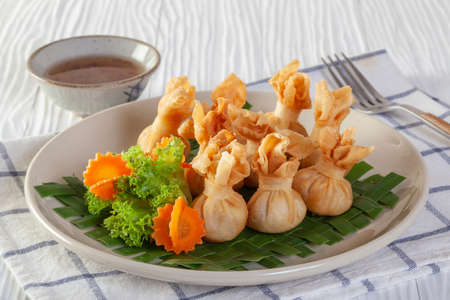 Traditional Thai food money bag or golden bag appetizersの写真素材