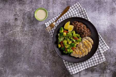 Keto Salad. Chicken grilled fillet with salad fresh tomatoes and avocado. Healthy food,の写真素材