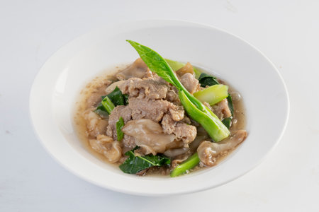 Noodles in Gravy with Pork isolated white backgroundの写真素材