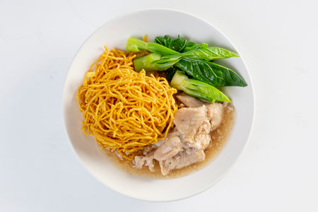 Noodles in Gravy with Pork isolated white backgroundの写真素材