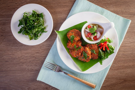 Thai Fish Cake Paste chili deep fried with herb and Crispy Thai Basil.の写真素材