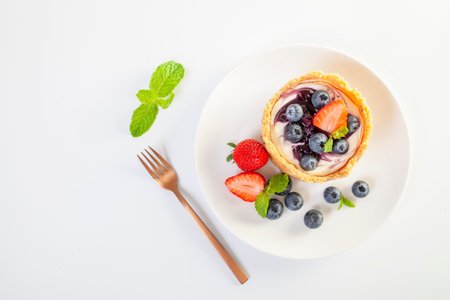Homemade cheesecake with fresh Strawberry and blueberries on the tableの写真素材