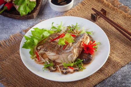 Steamed Grouper with Soy Sauce on the tableの写真素材