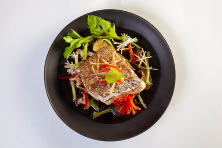 Steamed Grouper with Soy Sauce on a white backgroundの写真素材