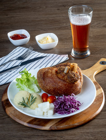 Deep fried pork knuckle in Frankfurt, German with potato and beerの写真素材