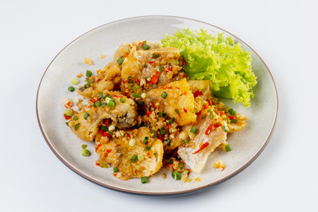 Fried snapper with chili and salt isolated on white backgroundの写真素材