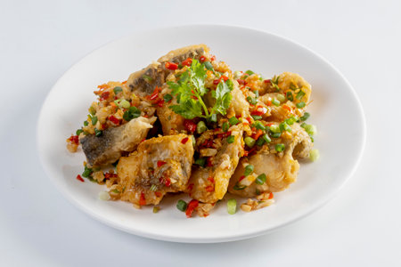 Fried snapper with chili and salt isolated on white backgroundの写真素材