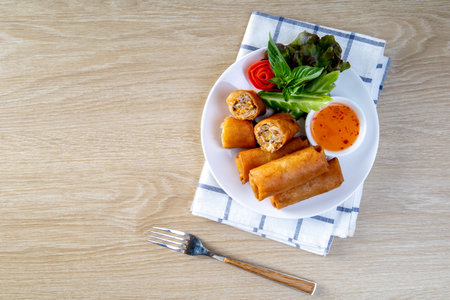 Fried spring rolls on the wooden tableの写真素材