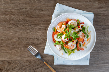 Spicy seafood salad, Thai spicy food recipe, Yum Spicy seafood on the tablewoodの写真素材