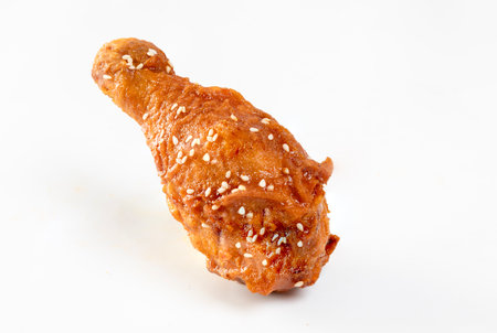 Fried chicken with Korean sauce on white backgroundの写真素材