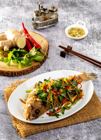 Deep Fried sea bass with sweet sauce and trimmingsの写真素材