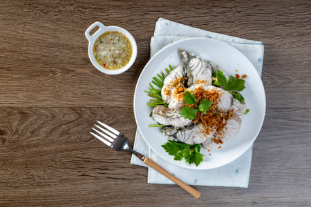 Steamed sea bass with dipping sauceの写真素材