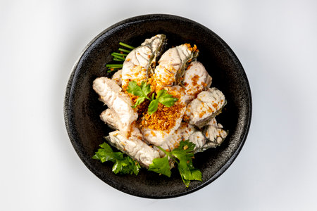 steamed sea bass sliced fish with dipping sauce and vegetableの写真素材