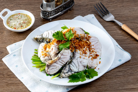 Steamed sea bass with dipping sauceの写真素材