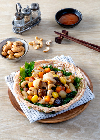 Stir fried mixed Chinese fruits and nuts on a wooden tableの写真素材