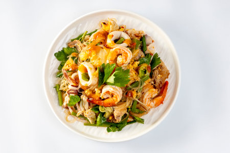 fried pork and seafood with vegetable and sauce, Thai street food