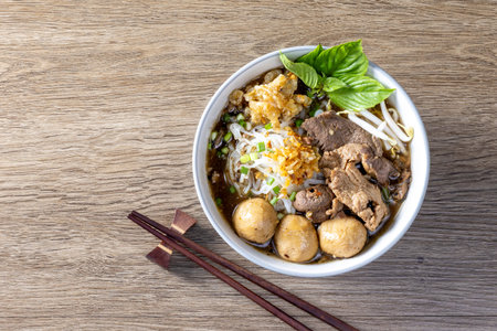 Boat noodles on a wooden table