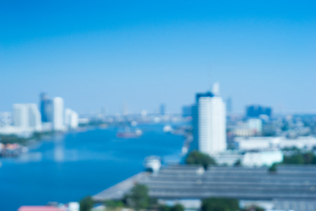 beautiful city background blur with blue sky.の写真素材